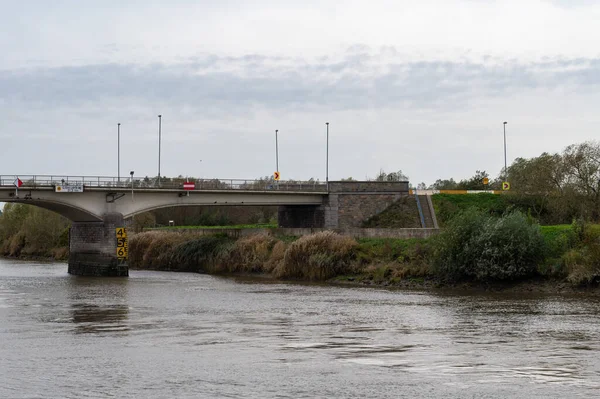 stock image Berlare, East Flemish Region, Belgium, 11 02 2022 - Bridge over the River Scheldt with green surroundings