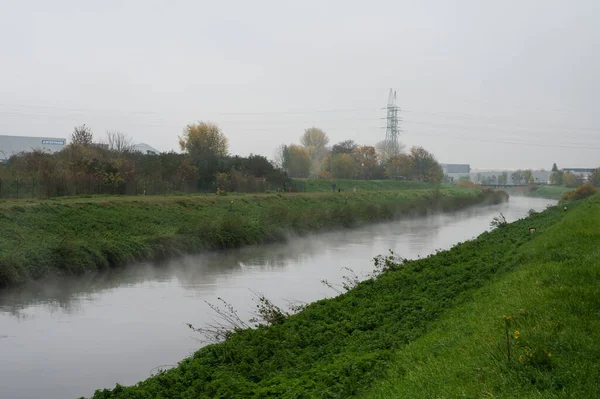 stock image Vilvoorde, Flemish Brabant, Belgium, 11 19 2022 - Industrial activity around the River Senne during foggy weather