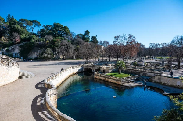 Nimes, Occitanie, France, 12 31 2022 - Water ponds and monuments in roman style of the Fountain parks and garden