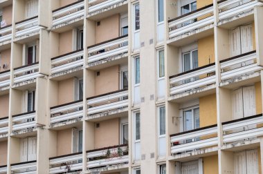 Ales, Occitanie, France, 12 30 2022 - Rectangular windows and balconies of residential apartment blocks
