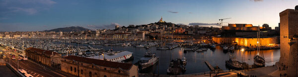 Marseille, Provence, France, 12 31 2022 - Extra large panoramic view over the old harbor at dusk
