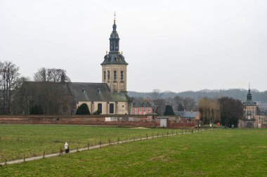 Kessel-Lo, Flemish Brabant, Belgium - Feb 11 2023 - The Park abbey tower and green surroundings around the railway station