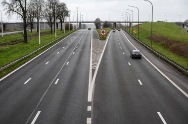 Grimbergen, Flemish Brabant Region -  Belgium - Feb. 19 2023 -  High angle view over the A12 speedway with low traffic