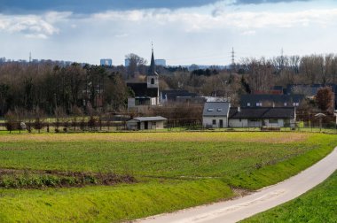 Rural path towards the village of Ossel, Merchtem, Flemish Brabant Region, Belgium