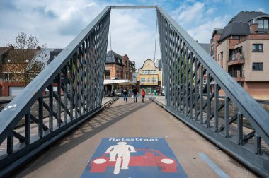 Dendermonde, East Flanders, Belgium - May 1, 2023 -  Metal bridge over the Dender river in old town clipart