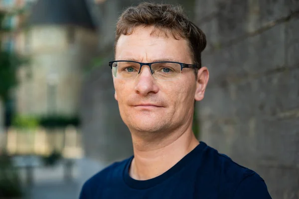 stock image Outdoor portrait of a serious 44 yo white man with eyeglasses, Brussels city center, Belgium