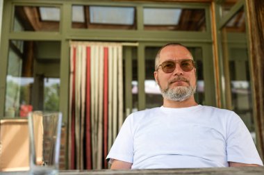 Casual portrait of a 48 yo white man wearing glasses, Borchtlombeek, Flanders, Belgium. Model released clipart