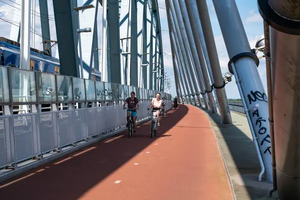 stock image Nijmegen, Gelderland, The Netherlands, July 11, 2024 - Pedestrian and cycling bridge over the river Waal