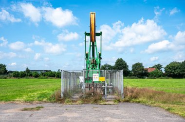 Osterwald, Lower Saxony, Germany -  July 14, 2024 - Industrial deep water mump at an agriculture field clipart