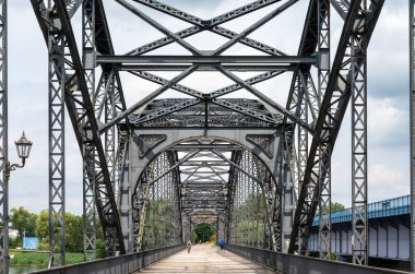 Hamburg, Germany, July 18, 2024 - Iron arched bridge, the Old Elbe bridge with a wooden floor, cyclists and pedestrians clipart