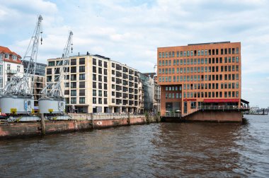 Hamburg, Germany, July 19, 2024 - Recreation zone of the Fischmarket with restaurants and offices at the banks of the river Elbe clipart