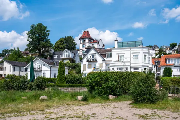 stock image Hamburg, Germany, July 19, 2024 - Vacation houses in country style at the banks of the river Elbe near Blankenese