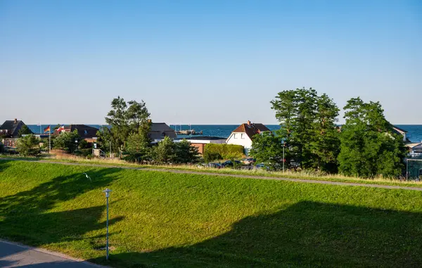 stock image Green dyke of the holiday village at the beach, Dahme, Germany