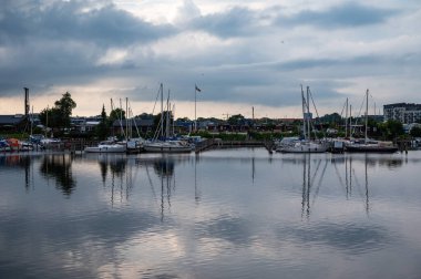 Copenhagen, Demark, July 23, 2024 -Reflections of the Fiskerihavnen or Fisherman harbour clipart