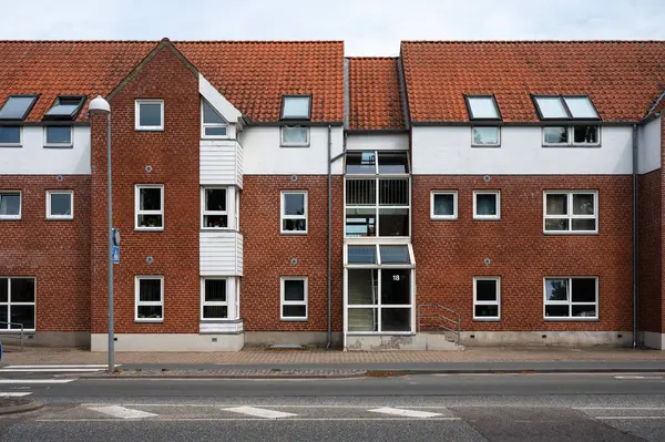 stock image Fredericia, Jutland, Denmark, July 25, 2024 - Brick stone facade of regular residential houses