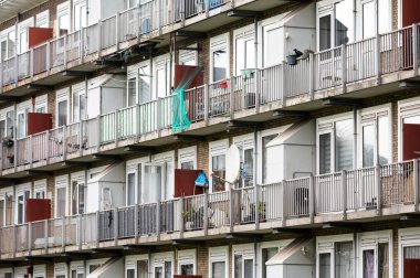 Glass balconies at a social apartment block in Amsterdam, The Netherlands, NOV 15, 2024 clipart