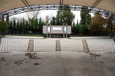 Open air theater and seats in the park of Tirana, Albania, DEC 8, 2024 clipart