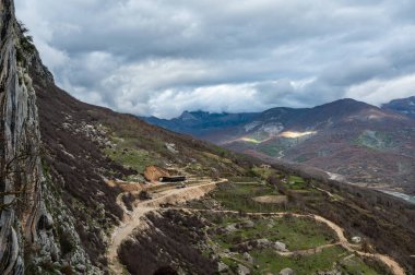 Dirty gravel road at Gamti Mountain near the artificial Bovilla Lake towards the restaurant, Albania clipart