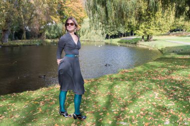 Outdoor portrait of a 31 yo woman in the Stuyvenberg Royal city park, Laeken , Brussels, Belgium. Model released clipart