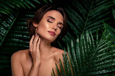 Stunning lady applying new collection aromatic body gel balm lotion soap on skin feel gentle touch of wild nature.