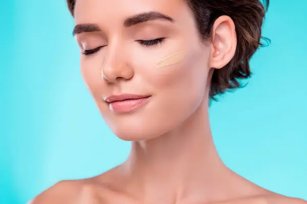 Photo of gentle attractive aesthetic lady applying tone cream gel enjoy softness fresh effect on skin.