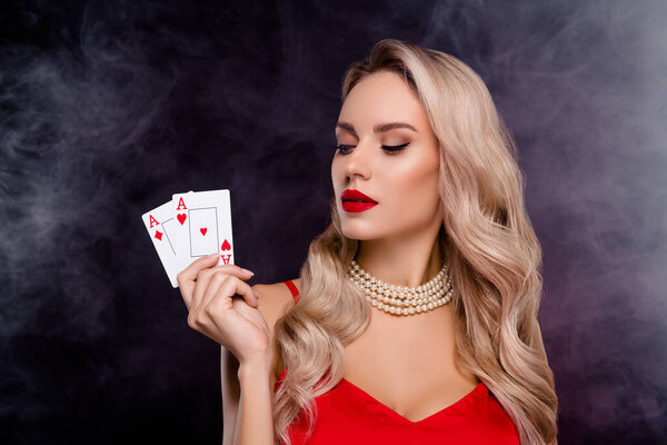 Photo of adorable successful lady wear sexy outfit playing cards casino isolated dark black color background.