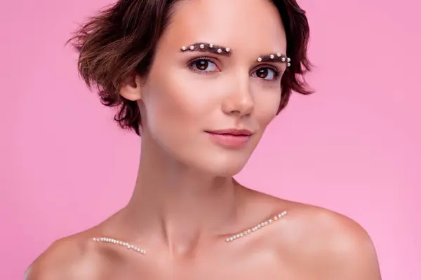 Portrait of lady prepare for wealthy occasion modern body care procedure with gemstone on pink background.