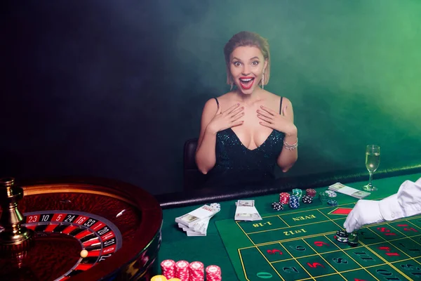 Photo of attractive excited chic lady feel joy black jack win after gamble in poker game casino club.