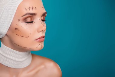 Photo of lady plastic surgery patient close eyes have correction marks on face for operation on cyan background.