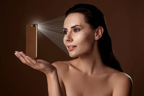 Futuristic concept collage of face detection technology young seductive lady unlocking phone over brown background.