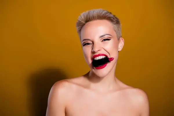 Photo Woman Hold Red Lipstick Bite Teeth Look Isolated Yellow — Stock Photo, Image