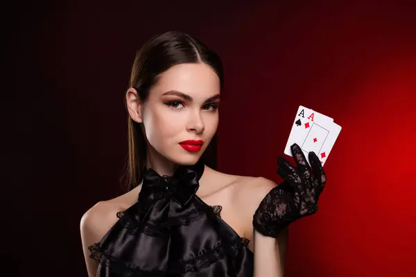 stock image Photo of lady in wealthy retro black dress gloves hold show two playing poker cards isolated red color background.