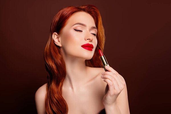 Photo of stunning attractive lady vogue star style hold red matte pomade isolated on brown color background.