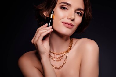 Closeup photo of cute young lady touch cheek perfect solution anti aging product isolated on black color background.