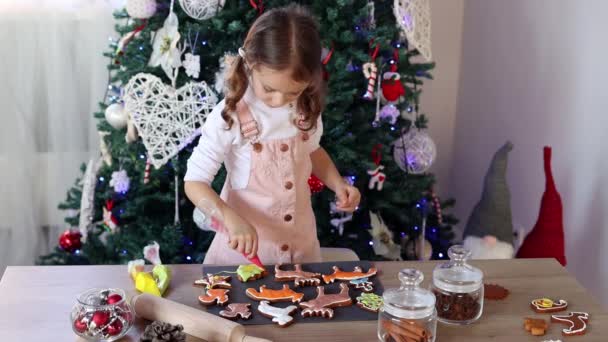 Happy Little Girl Coloring Christmas Gingerbread Cookies Home Slow Motion — Stock Video