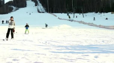 People ski on the snow slope in the winter ski resort. Ski elevator on snow mountain. Winter activity. The concept of rest, hobbies, health.