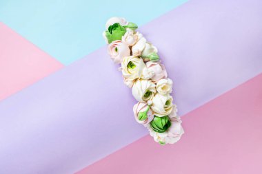 Flower arrangement on a colored pastel background. Layout with flowers.