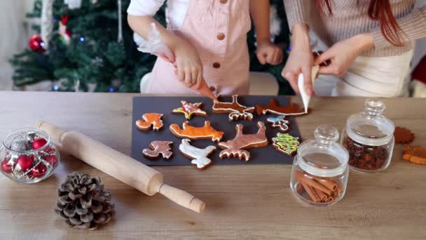 Happy Little Girl Her Beautiful Mom Coloring Christmas Gingerbread Cookies — Stock Video