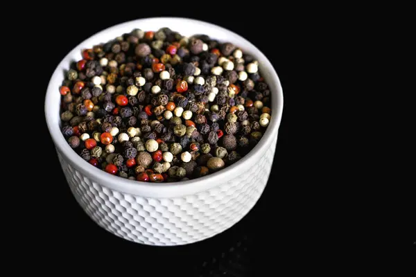 Mixture Pepper Varieties Peas White Plate Black Background Heap Various — Stock Photo, Image