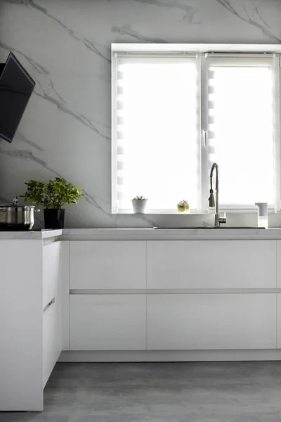 White scandinavian kitchen interior. A modern comfortable kitchen in a minimalist style. Interior design concept.