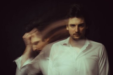 schizophrenic abstract blurry portrait of man with mental disorders and mental illnesses on dark background