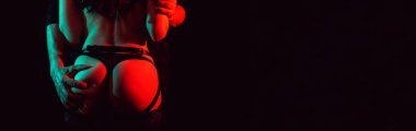 male hands touch the female ass during foreplay in sex. Panoramic wide horizontal photo for banner head cover