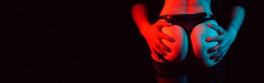 male hands passionately touch the sexy ass of a naked girl. Panoramic wide horizontal photo for banner head cover