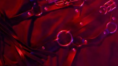 Set of erotic sex toys for adults. Handcuffs, leather whip flogger, mask, choker and butt plug for sex with domination and submission