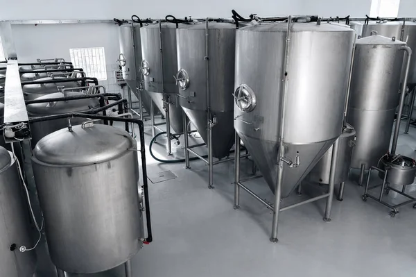 interior of a modern brewery with beer fermentation tanks