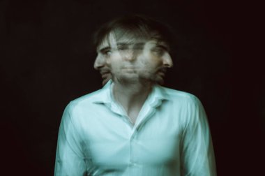 schizophrenic abstract blurry portrait of man with mental disorders and mental illnesses on dark background