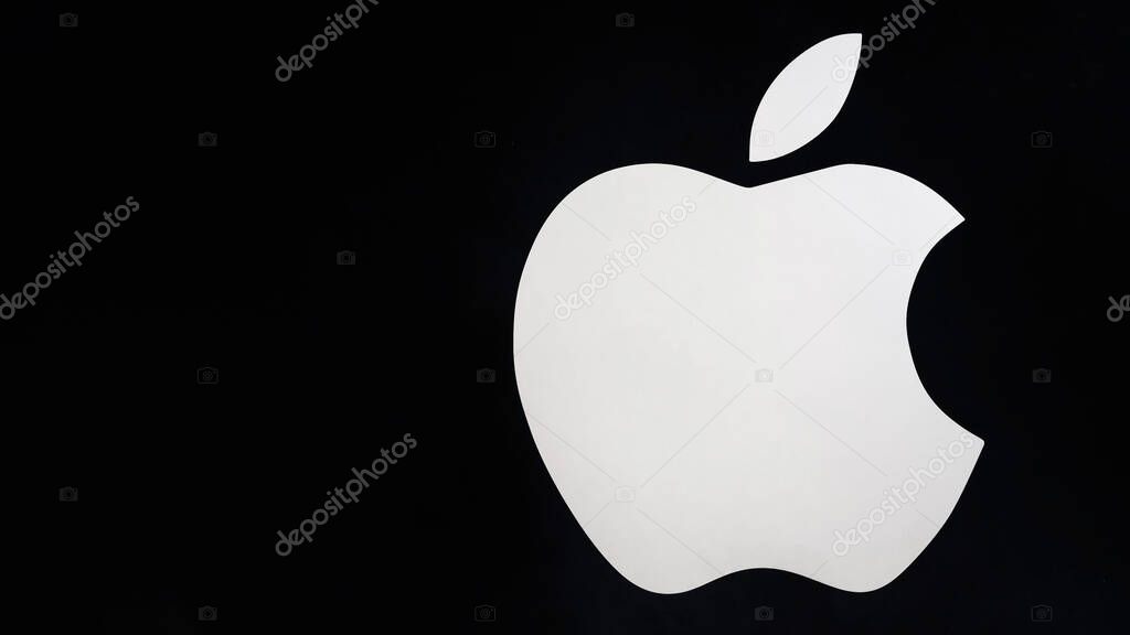 SHYMKENT, KAZAKHSAN - JANUARY 23, 2023: Apple logo on a black background on the wall of an electronics store