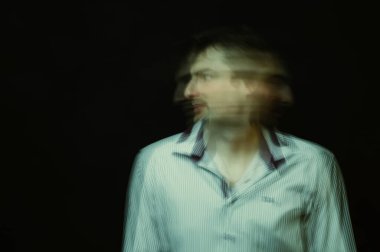 schizophrenic abstract blurry portrait of man with mental disorders and mental illnesses on dark background