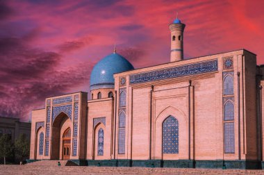 ancient medieval Muslim mosque Hazrati Imam in Tashkent in Uzbekistan. Islamic asian architectural complex Khast Imam at sunset with beautiful sky clipart
