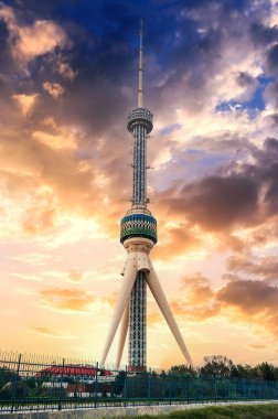 landmark television TV tower in Tashkent in Uzbekistan under a cloudy sky at sunset in summer clipart